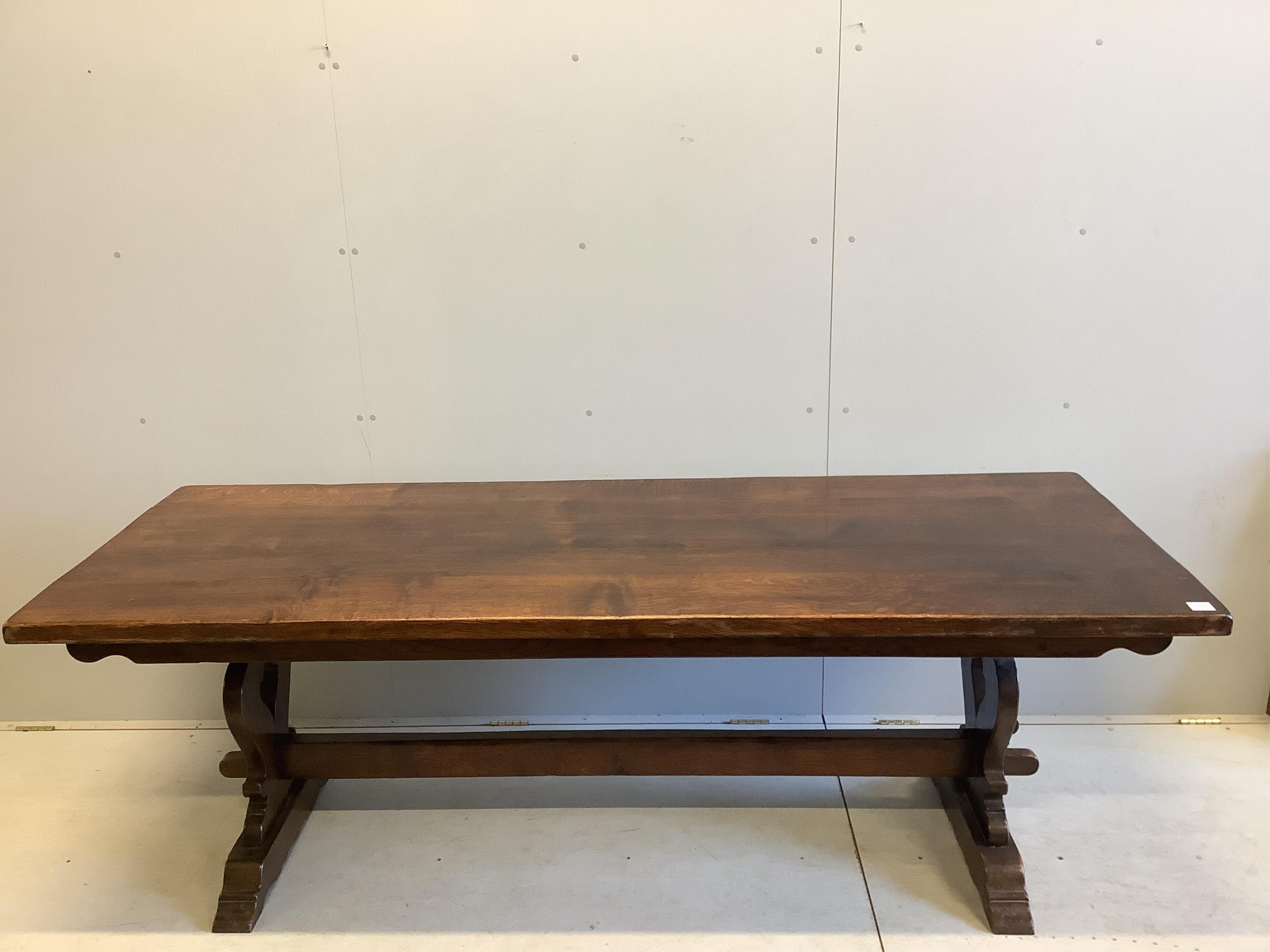 An 18th century style rectangular oak refectory dining table, width 222cm, depth 83cm, height 76cm. Condition - fair